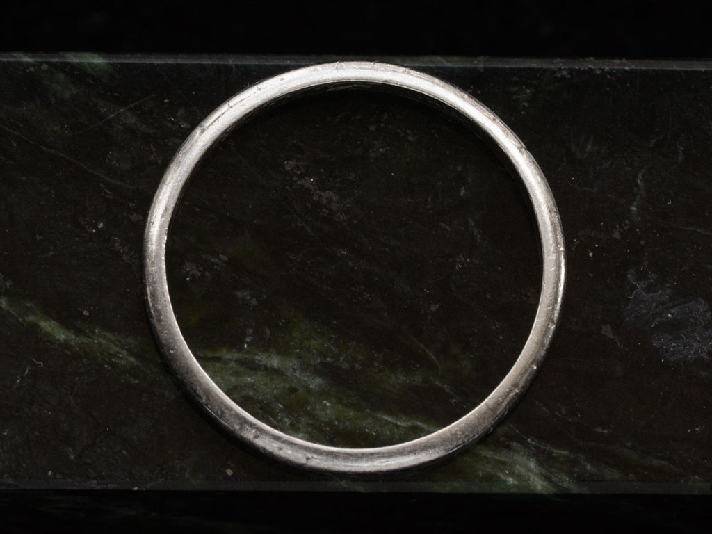 1924 Patterned Platinum Band (side profile view on dark marble background)