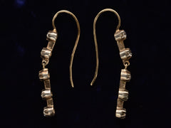 thumbnail of Side profile of c1900 Five Diamond Drop Earrings in Yellow Gold (on dark background)