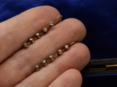 thumbnail of Front view of c1900 Five Diamond Drop Earrings in Yellow Gold (on hand for scale)