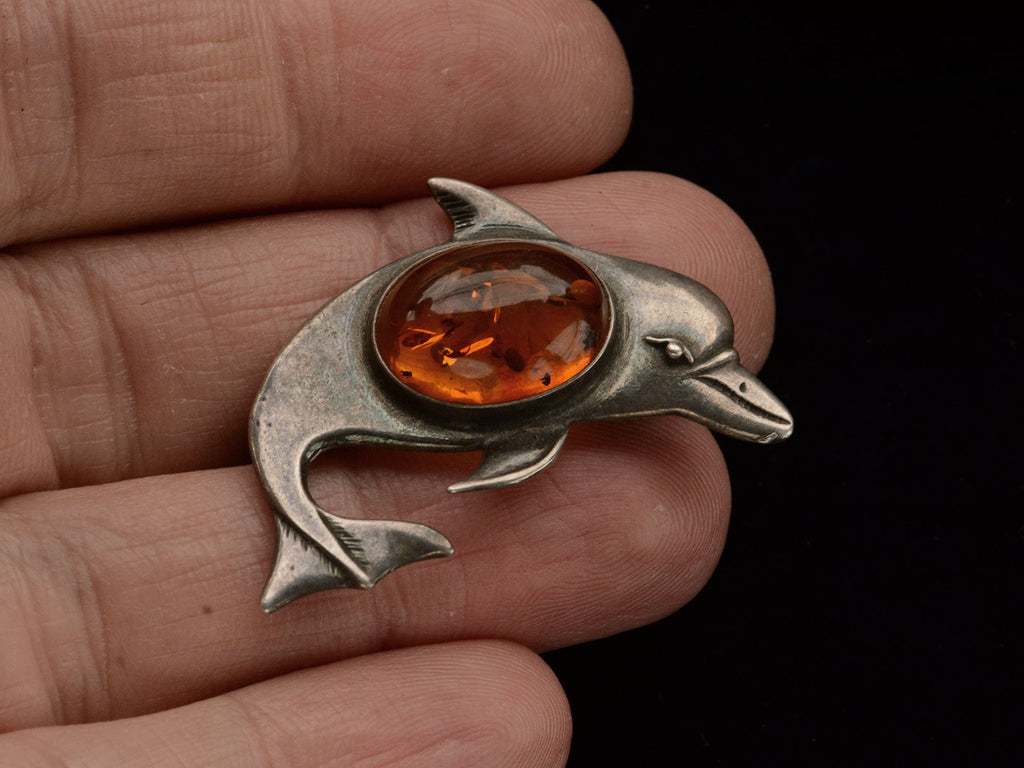 c1980 Amber Dolphin Brooch (on hand for scale)