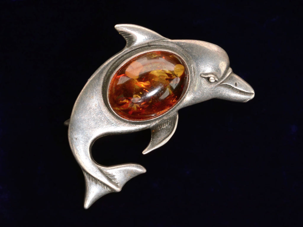 c1980 Amber Dolphin Brooch (on black background)
