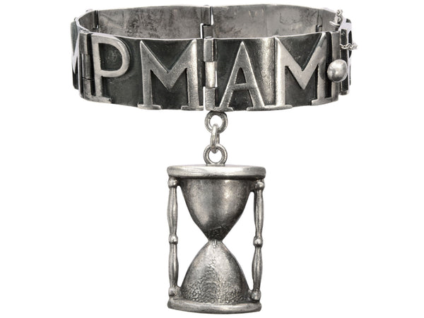 Vintage Margot de Taxco bracelet with "AM" and "PM" panels and an hourglass, shown on white background.
