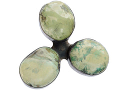 thumbnail of A large vintage c19980 brooch with three oval turquoise stones set in silver in a clover-like formation. (Shown on white background)