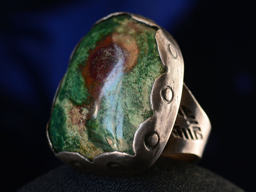 Right angled view of c1960 Turquoise Slab Silver Ring (on black background)