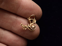 thumbnail of 1963 Coach & Horse Charm (on hand for scale)