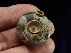 thumbnail of c1890 Stone Compass (on hand for scale)