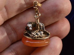 c1850 Dog & Rabbit Fob (on hand to show scale)