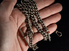 thumbnail of 1904 Double Albert Chain (on hand for scale)
