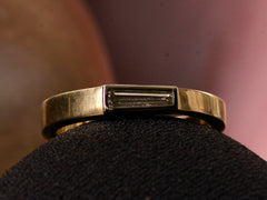 thumbnail of EB 0.19ct Tapered Diamond Baguette Ring in Yellow Gold and Platinum (on dark pink background)