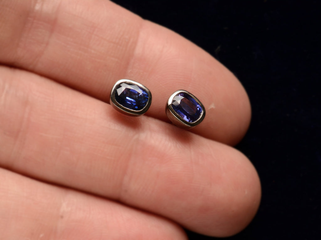 EB Purplish Sapphire Studs in Blackened Gold (on hand for scale)