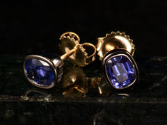 thumbnail of EB Purplish Sapphire Studs in Blackened Gold (angled detail view on dark background)