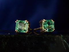 thumbnail of Angled front view of c1980 Colombian Emerald Studs in Yellow Gold (shown on dark background)