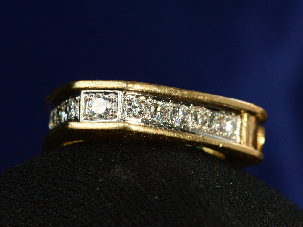 Right angled view of c1970 Emerald & Diamond Ring in Yellow and White Gold (shown on dark background)