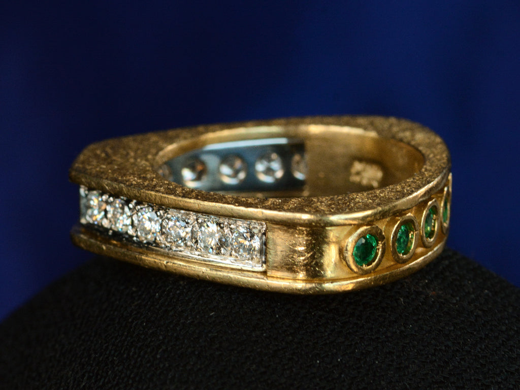 Side view of c1970 Emerald & Diamond Ring in Yellow and White Gold (shown on dark background)