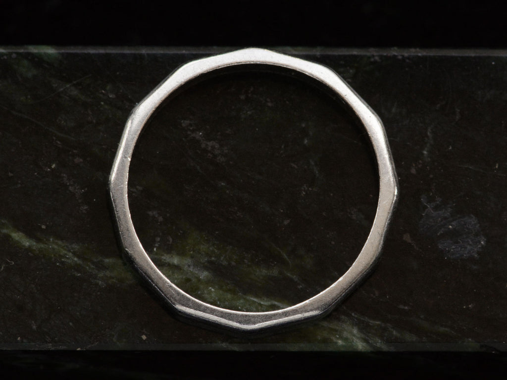 c1940 Faceted Platinum Band (profile view on green marble)