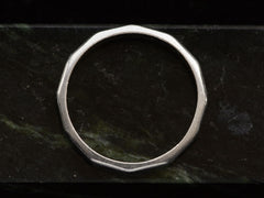thumbnail of c1940 Faceted Platinum Band (profile view on green marble)