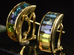 thumbnail of Angled view of vintage c1990 Yellow Gold Earrings with Zircon, Aquamarine, Tanzanite, Peridot and Citrine Set in an Arching Form (Shown on dark background)
