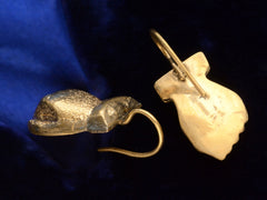 thumbnail of Angle and reverse side view of pair of Victorian gold fist earrings (on dark background)