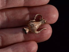 thumbnail of c1890 Victorian Kettle Charm (on hand for scale)