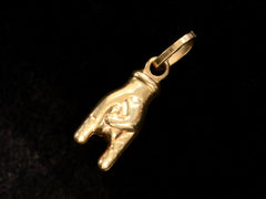 thumbnail of c1980 Gold Mano Cornuto Charm (reverse side black background)
