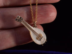 thumbnail of c1890 Mother of Pearl Lute (on hand for scale)