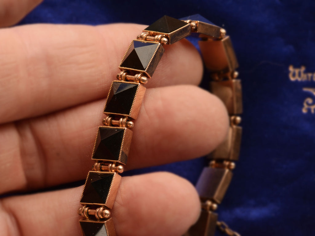 Detail view of c1890 Pyramidal Onyx and Rose Gold Bracelet (shown on hand for scale)