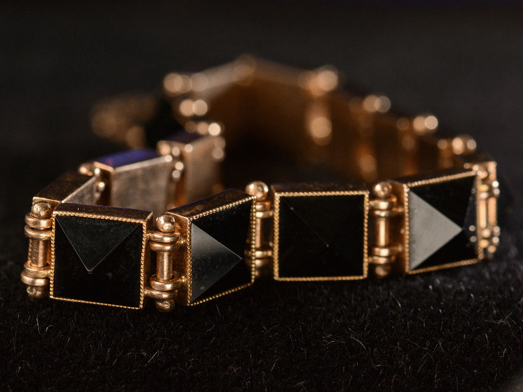Detail of panels of c1890 Pyramidal Onyx and Rose Gold Bracelet (shown on black background)