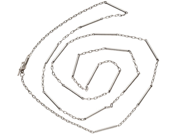 Art Deco platinum chain with cable and bar links, shown spiraled on white background.