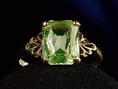 thumbnail of Front profile of c1930 Rectangular Uranium Glass Ring with Filigreed Yellow Gold Mounting (on dark background)