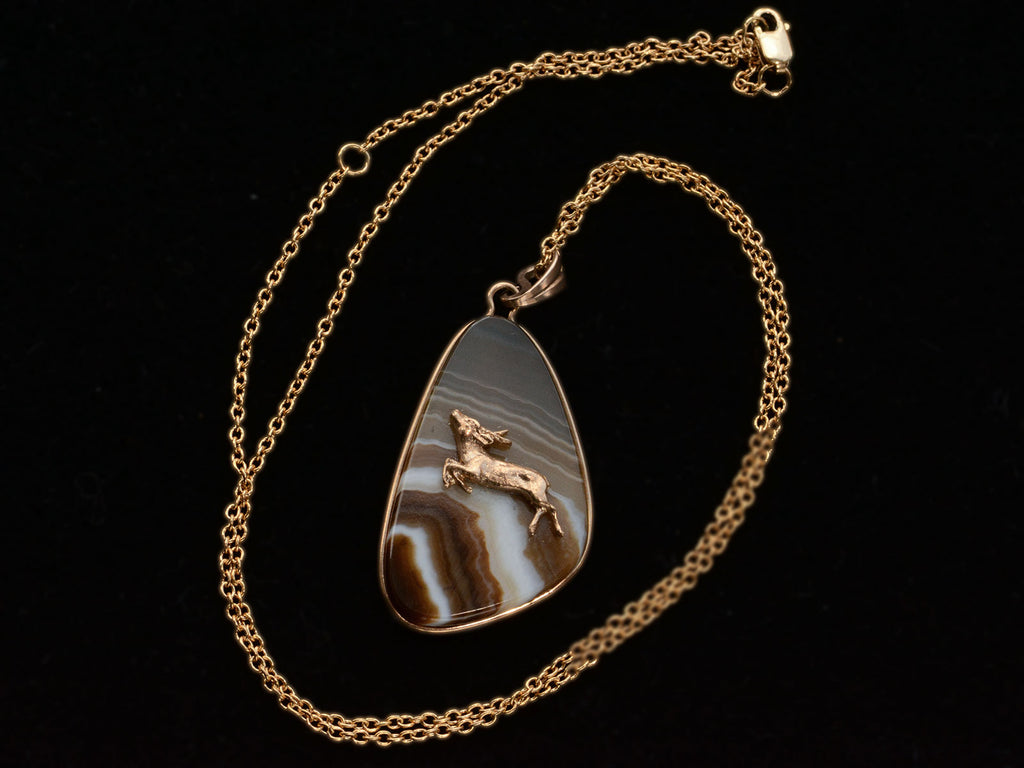 c1970 Stag Agate Pendant showing chain on black background
