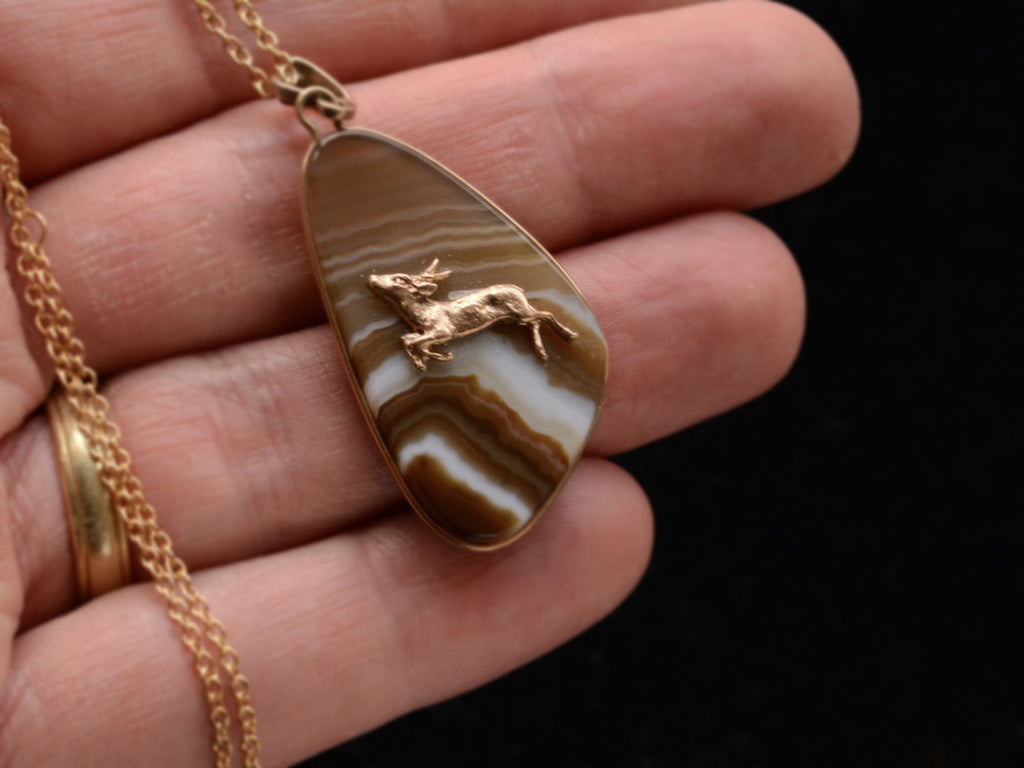 c1970 Stag Agate Pendant on hand for scale