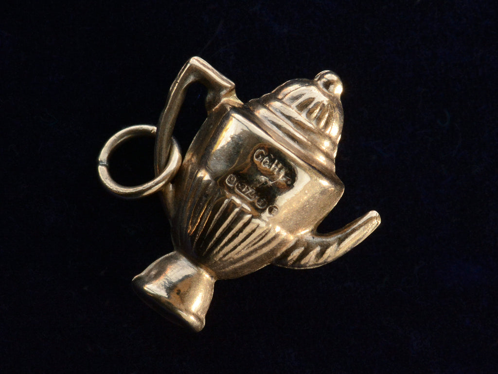 The reverse side of 1964 Gold Teapot Charm showing English hallmarks and the date letter "i."
