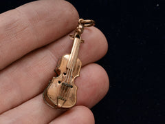 thumbnail of c1900 Violin Pendant (on hand for scale)