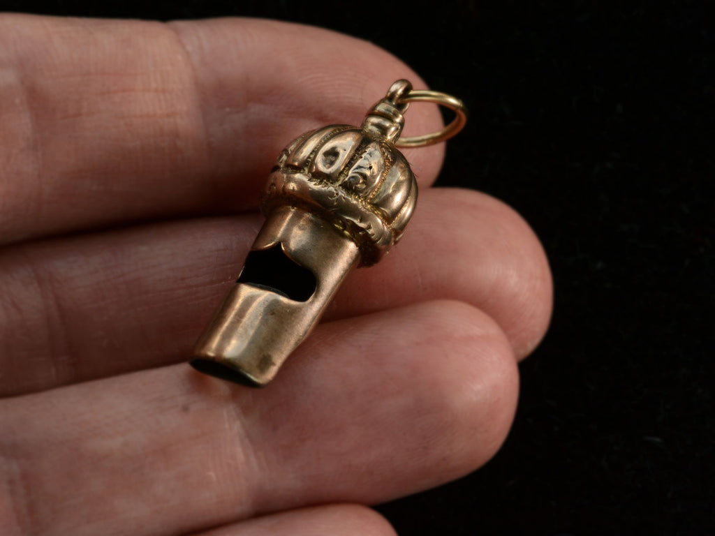 c1890 Gold Whistle Pendant (top view on hand for scale)