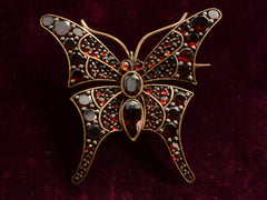 c1900 Garnet Butterfly Pin (on black background)