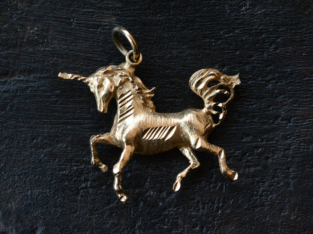1980s Gold Unicorn Charm (on black background)