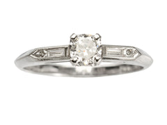 thumbnail of Vintage c1940 white gold engagement ring with small round diamond and rectangular baguettes on either side. Shown on white background.