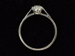 thumbnail of Side profile of a simple 1920 solitaire engagement ring with a old European cut diamond set in 18K white gold, shown on black background.