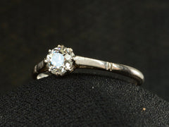 thumbnail of Angled front view of a simple 1920 solitaire engagement ring with a old European cut diamond set in 18K white gold, shown on white background.