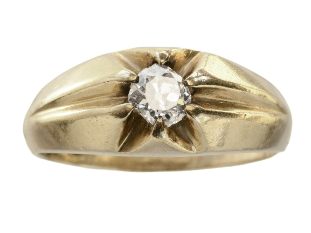 Wide antique men's ring with cushion shaped old cut white diamonds set in yellow gold, shown on white background.