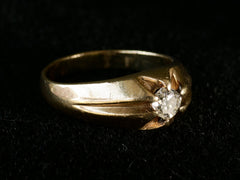 thumbnail of Left angled view of wide antique men's ring with cushion shaped old cut white diamonds set in yellow gold, shown on dark background.