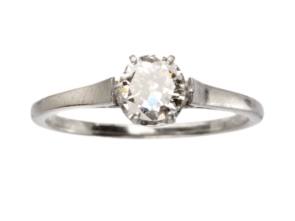 A simple Art Deco white gold solitaire with a round old European cut diamond, shown on white background.