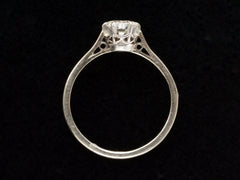 thumbnail of Side profile of an Art Deco white gold solitaire with a round old European cut diamond, shown on black background.