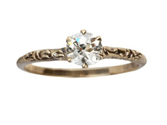 thumbnail of Victorian solitaire with a slightly oval shaped diamond set in a pattered slender rose gold mounting, shown on white background.