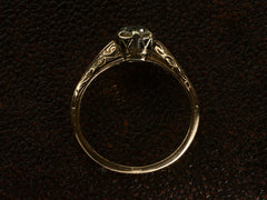 thumbnail of Side profile of antique engagement ring with a 0.75ct old European cut diamond set in a detailed 14K rose gold mounting, shown on dark textured background.
