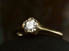 thumbnail of Angled front view of c1920 Art Deco yellow gold engagement ring with a 0.64ct round diamond (on dark background)