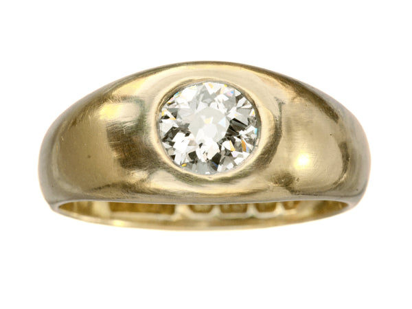 A wide rounded antique yellow gold ring with a flush-set old European cut diamond, shown on white background.