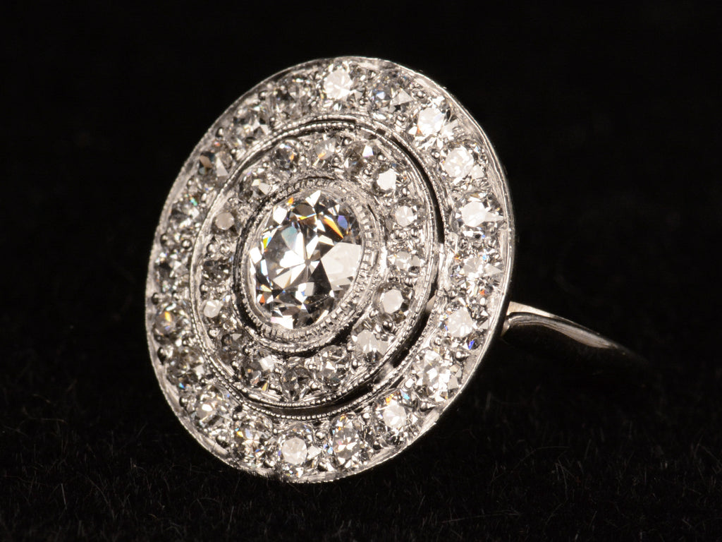 c1920 Art Deco Diamond Cluster Ring (right angle view on black background)