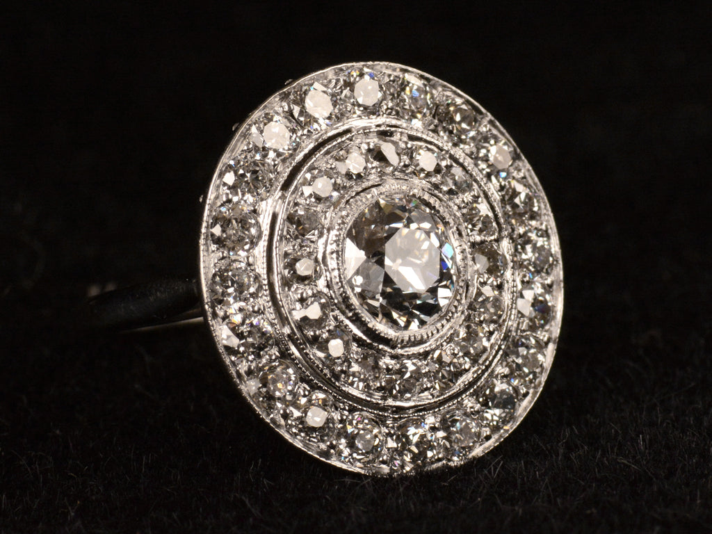 c1920 Art Deco Diamond Cluster Ring (left angle view on black background)