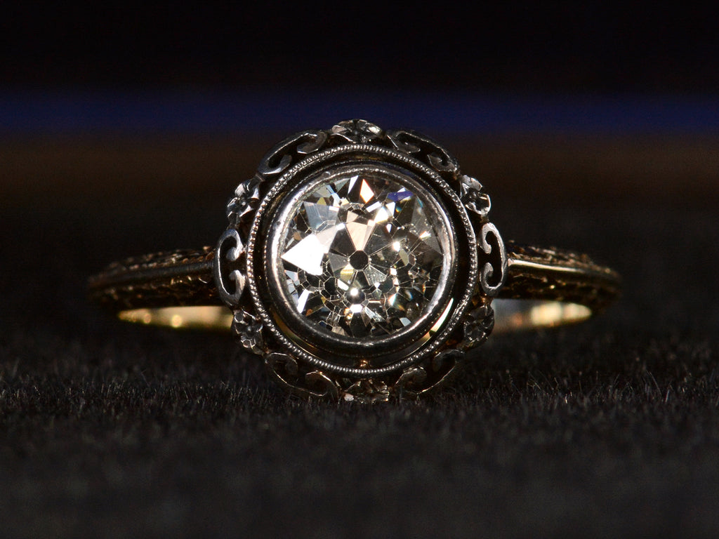 Detail view of diamond in c1900 engagement ring, shown on dark background